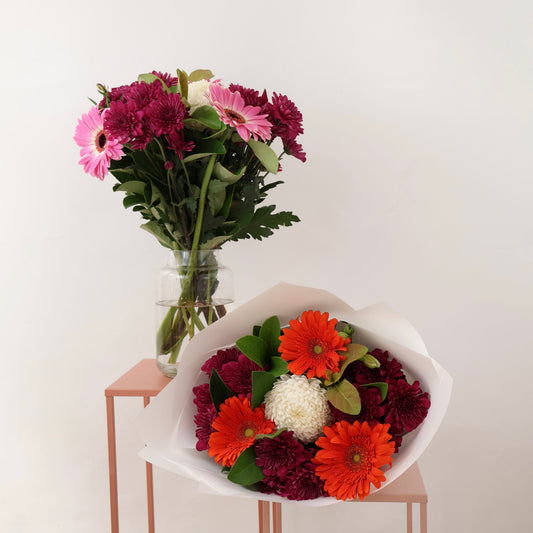 Signature fresh flower bouquet in white wrapping.
